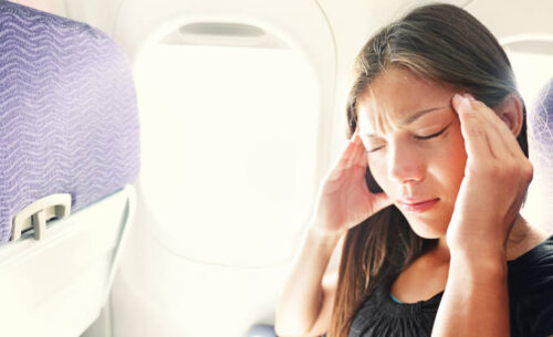 Fear of flying woman in plane airsick