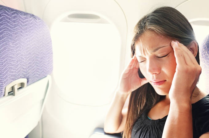 Fear of flying woman in plane airsick