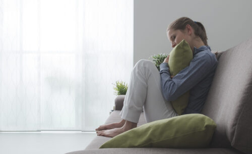 Woman Hugging a Pillow Cropped