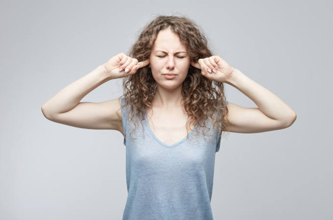 Stressed woman on grey background