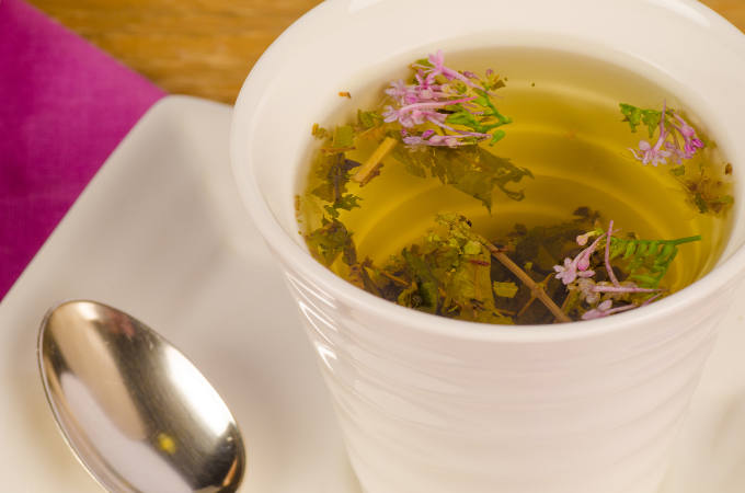 Closeup of a cup containing herbal tea