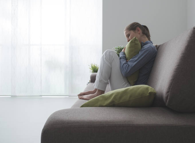 Woman hugging a pillow
